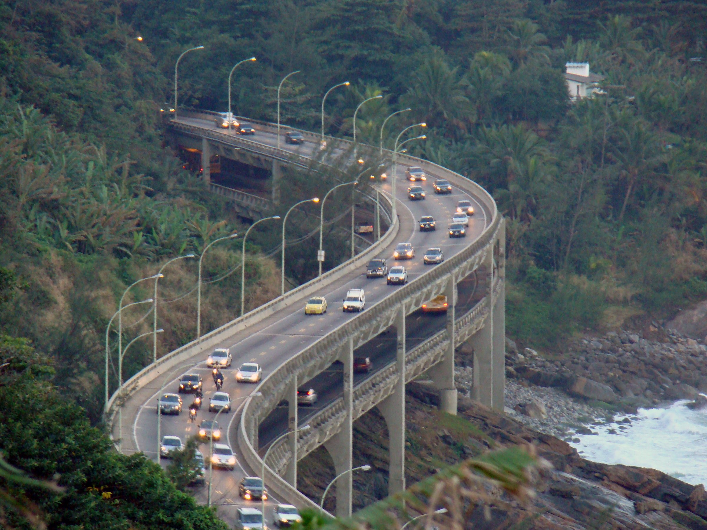 The Elevado do Joá — the elevated coast road that threads the cliffs between São Conrado and Barra.