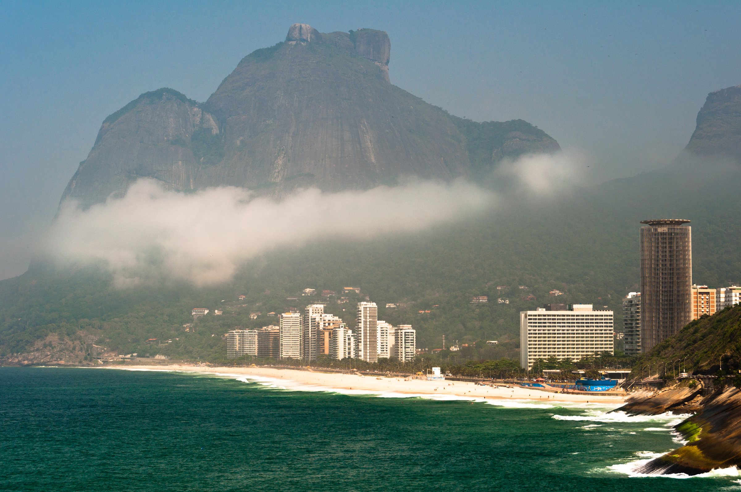 The monolith from the water — Pedra da Gávea anchors the horizon along the Joá coast.