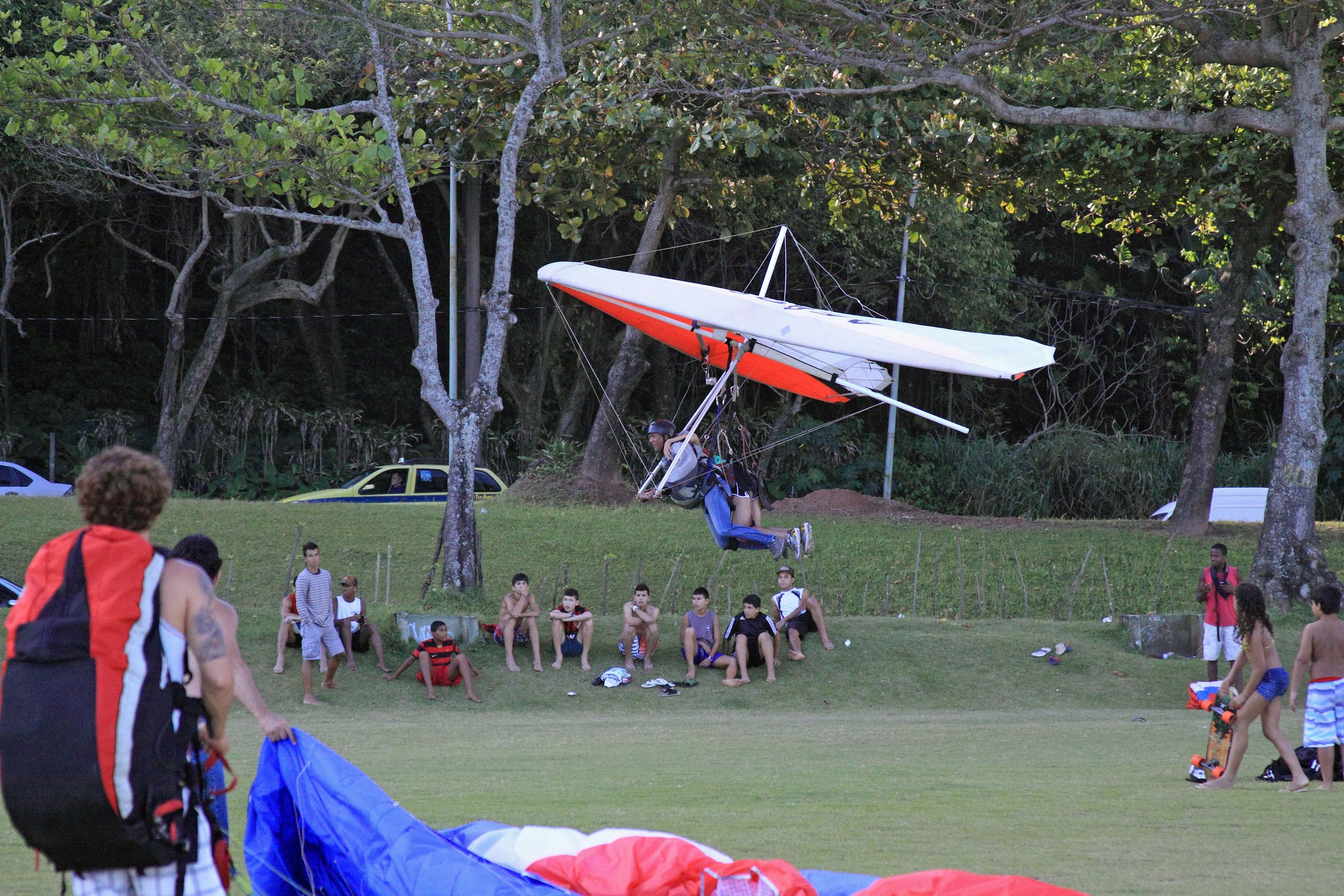 A hang-glider settling onto the sand at São Conrado, the beach next door to Joá.